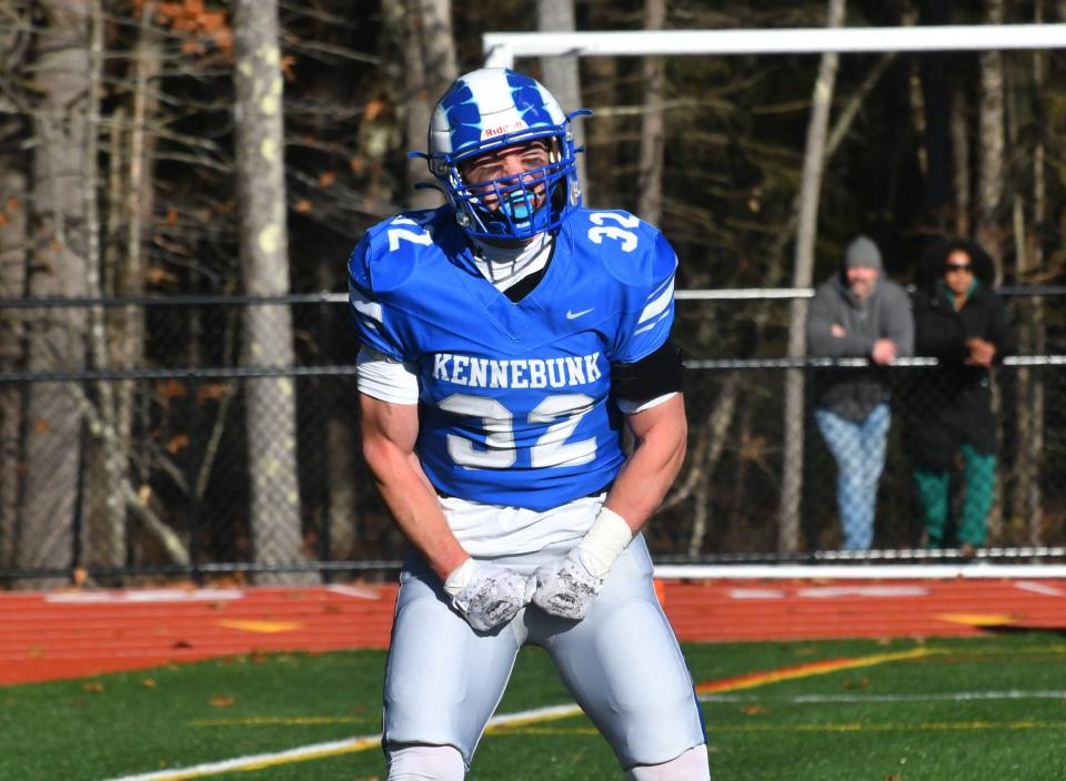 Kennebunk fullback Jonah Barstow celebrates one of his three touchdowns during the Rams’ 36-17 win over Massabesic on Saturday in the Class B South championship in Kennebunk, Maine.