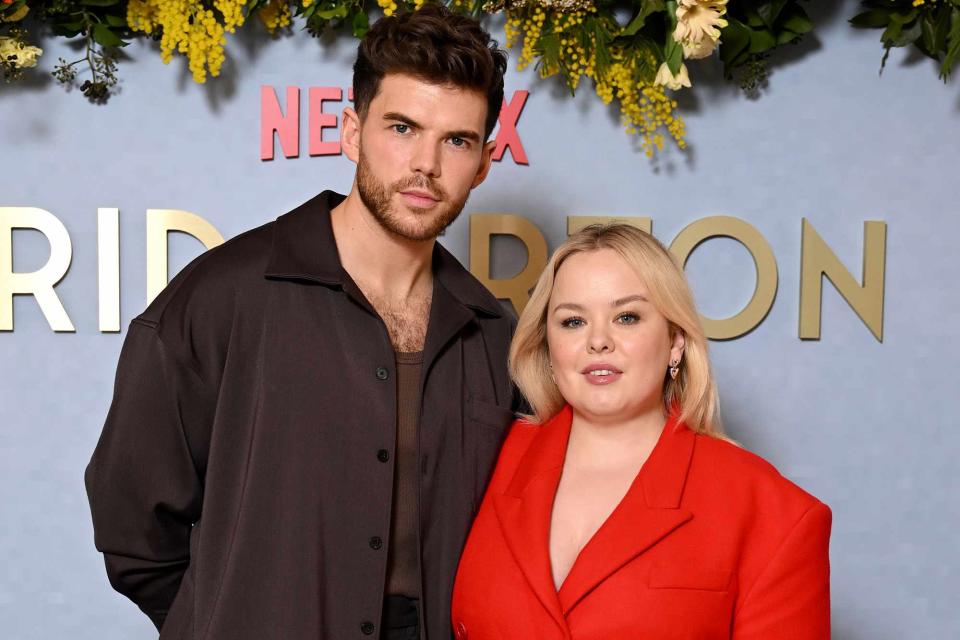 <p>Gareth Cattermole/Getty</p> Luke Newton and Nicola Coughlan attend the Season 3 screening of "Bridgerton" on February 14, 2024 in London, England. 