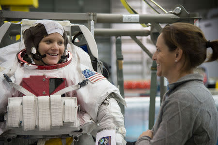 Astronaut Anne McClain (L) is seen during training at the Neutral Buoyancy Laboratory in Houston, Texas, U.S., January 12, 2015. Lauren Harnett/NASA-JSC/Handout via REUTERS