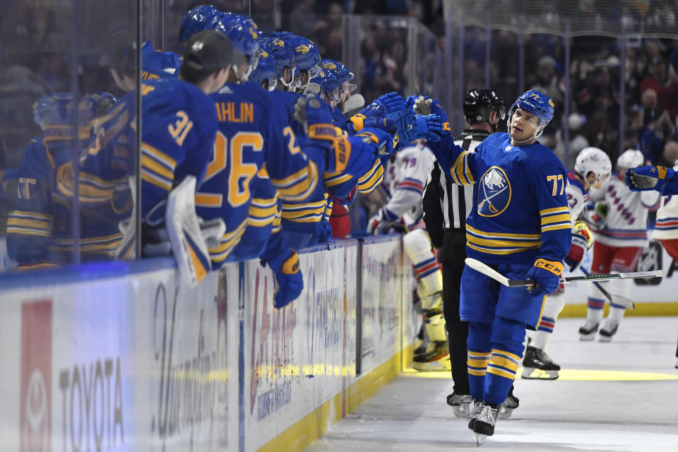 Buffalo Sabres right wing JJ Peterka, right, is congratulated after scoring against the New York Rangers during the first period of an NHL hockey game in Buffalo, N.Y., Friday, March 31, 2023. (AP Photo/Adrian Kraus)