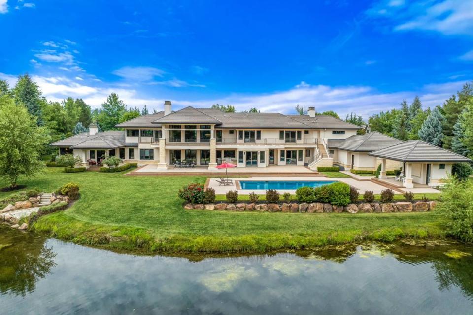 The $6.2 million, 8,153-square-foot home sits next to a human-made lake in the Two Rivers community.