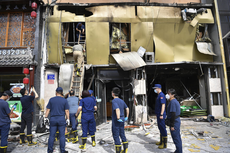 CORRECTS DATE TO THURSDAY JUNE 22, 2023 - In this photo released by Xinhua News Agency, members of a team dispatched by China's Ministry of Emergency Management conduct an inspection at the site of an explosion at a restaurant in Yinchuan, northwest China's Ningxia Hui Autonomous Region, Thursday, June 22, 2023. China's president Xi Jinping ordered a national safety campaign on Thursday after a massive cooking gas explosion at a barbecue restaurant in the northwest killed 31 people and injured seven others on the eve of a long holiday weekend. (Wang Peng/Xinhua via AP)