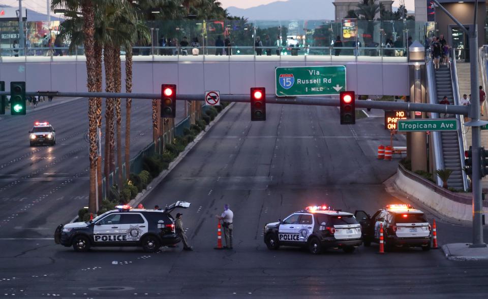 <p>Police block the roads leading to the Mandalay Hotel (background) and inspect the site after a gunman attack in Las Vegas, Nev., on Oct. 2, 2017. (Photo: Bilgin S. Sasmaz/Anadolu Agency/Getty Images) </p>