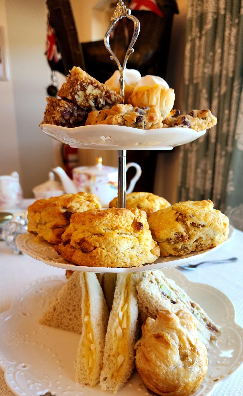 Val's English Tea & Pie Shop serves a variety of tea sandwiches, homemade scones and sweets with a pot of one of their teas.