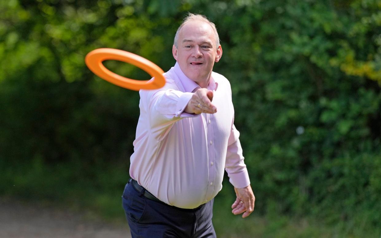 Sir Ed Davey, the leader of the Liberal Democrats, plays with a flying disc during a visit to Crowd Hill Farm in Hampshire