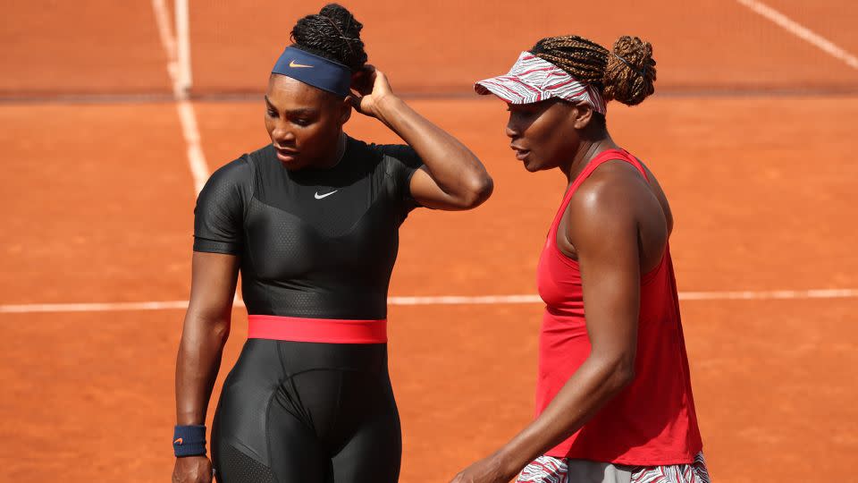 Serena and Venus Williams on the court at the 2018 French Open. The tournament said it wouldn't permit catsuits in future editions, but the Women’s Tennis Association amended their rules to allow leggings without skirts. - Matthew Stockman/Getty Images