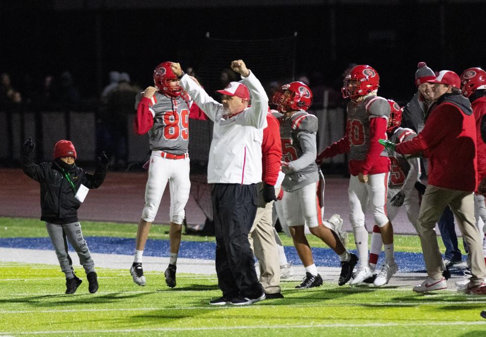 Canton South head coach Matt Dennison celebrates a win over Struthers in a regional final Friday, Nov. 17, 2023.