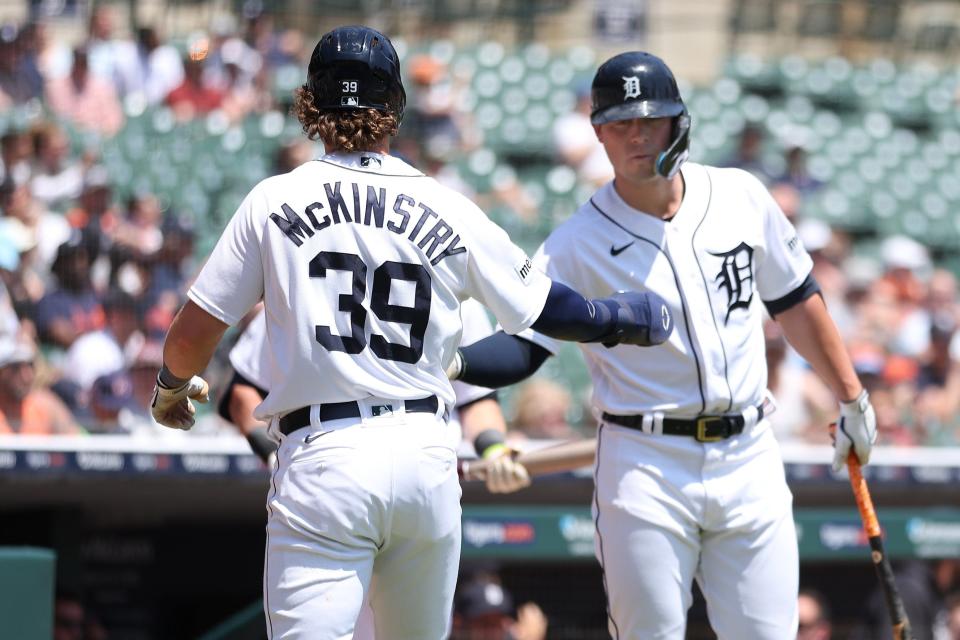 Zach McKinstry of the Detroit Tigers celebrates scoring a third-inning run with Spencer Torkelson while playing the Texas Rangers at Comerica Park on May 31, 2023 in Detroit, Michigan.
