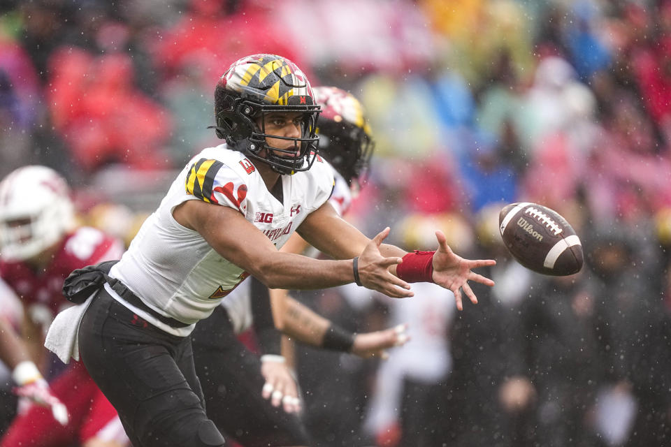 Maryland quarterback Taulia Tagovailoa (3) pitches the ball off during the first half of an NCAA college football game against Wisconsin Saturday, Nov. 5, 2022, in Madison, Wis. (AP Photo/Andy Manis)