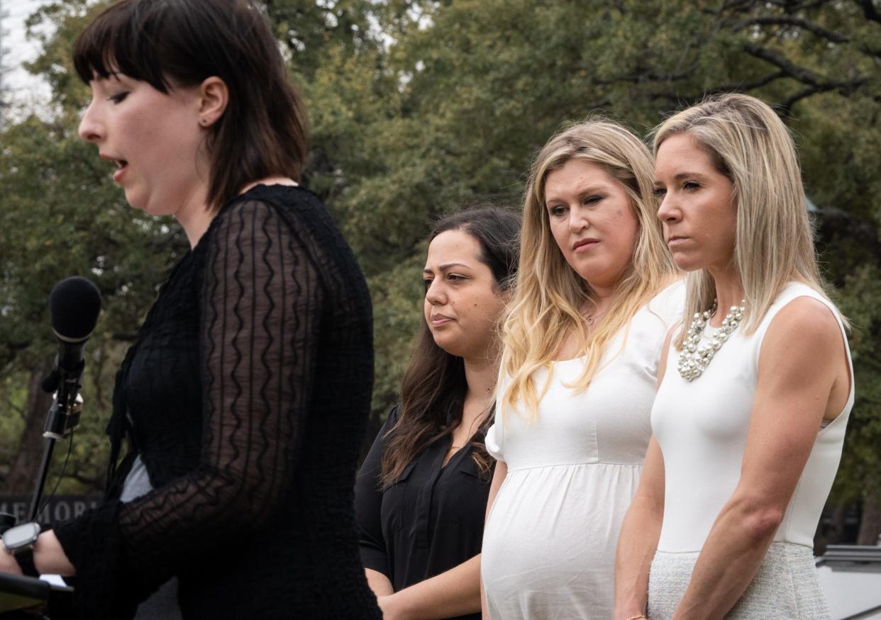 Anna Zargarian, Lauren Miller and Amanda Zurawski listen to fellow plaintiff Lauren Hall share her story in front of the Capitol on March 7 as they announced a lawsuit that argues the Texas abortion ban doesn't adequately outline the medical exceptions that allow a patient to terminate a pregnancy to save her life.