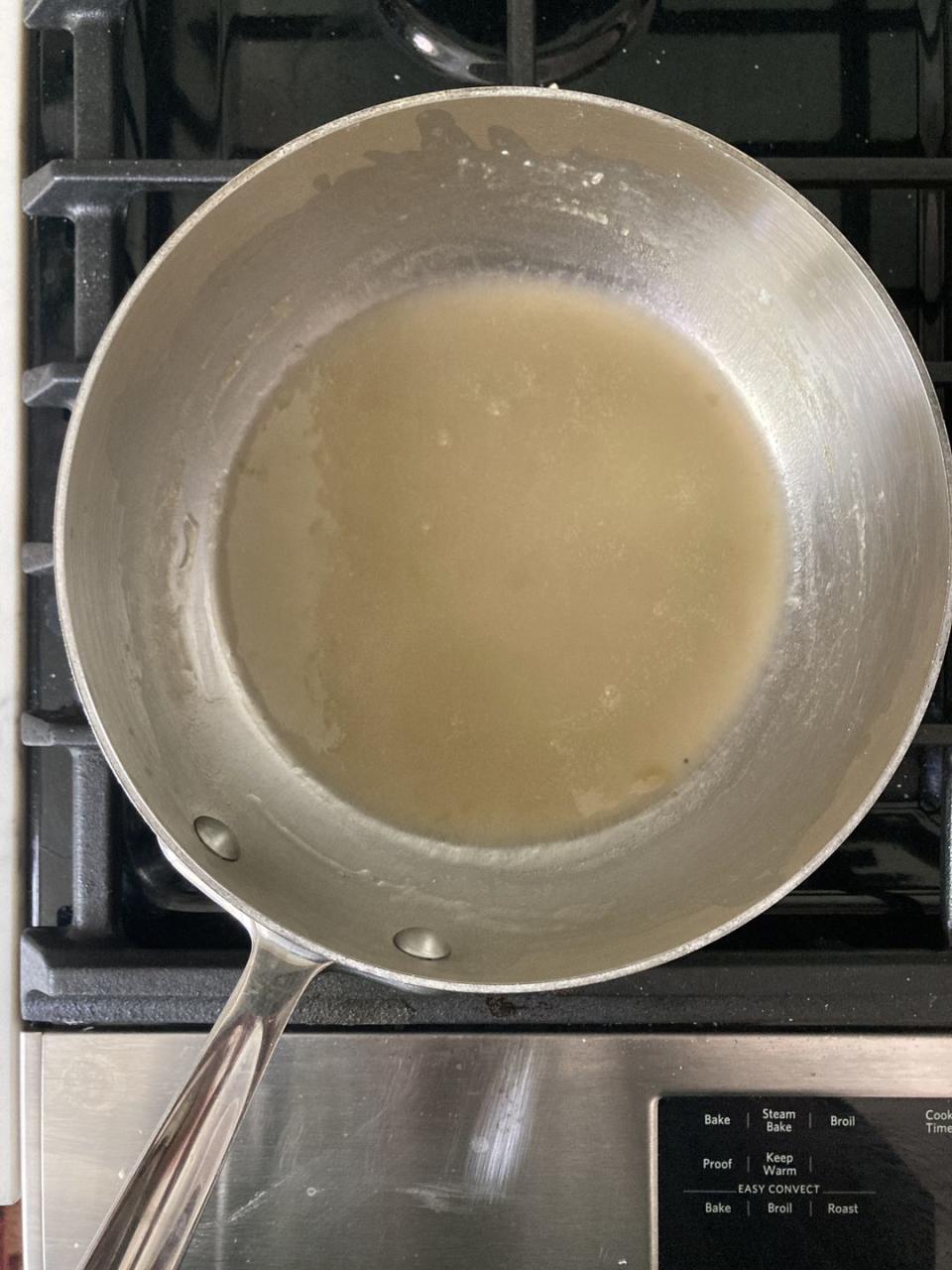 thickened chicken stock in a pot on the stove