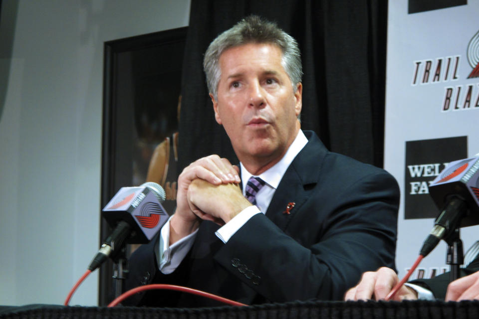 FILE - Portland Trail Blazers general manager Neil Olshey speaks during an NBA basketball news conference on Aug. 8, 2012, in Portland, Ore. The Trail Blazers fired Olshey on Friday, Dec. 3, 2021, for violating the the team’s code of conduct. The team hired an outside firm last month to investigate workplace environment concerns. (AP Photo/Nigel Duara, File)