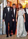 The Duke and Duchess of Cambridge looked smashing as they hosted a charity reception at St. James Palace in London late last week. Prince William donned a standard double-breasted tux, while his gorgeous wife Kate opted for a Grecian-inspired satin gown, courtesy of Brit designer Jenny Packham. (11/10/2011)