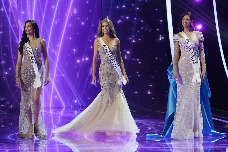 Miss Thailand Anntonia Porsild, from left, Miss Australia Moraya Wilson and Miss Nicaragua Sheynnis Palacios, react after being named the final three contestants during the 72nd Miss Universe pageant, in San Salvador, El Salvador, Saturday, Nov. 18, 2023. (AP Photo/Moises Castillo)