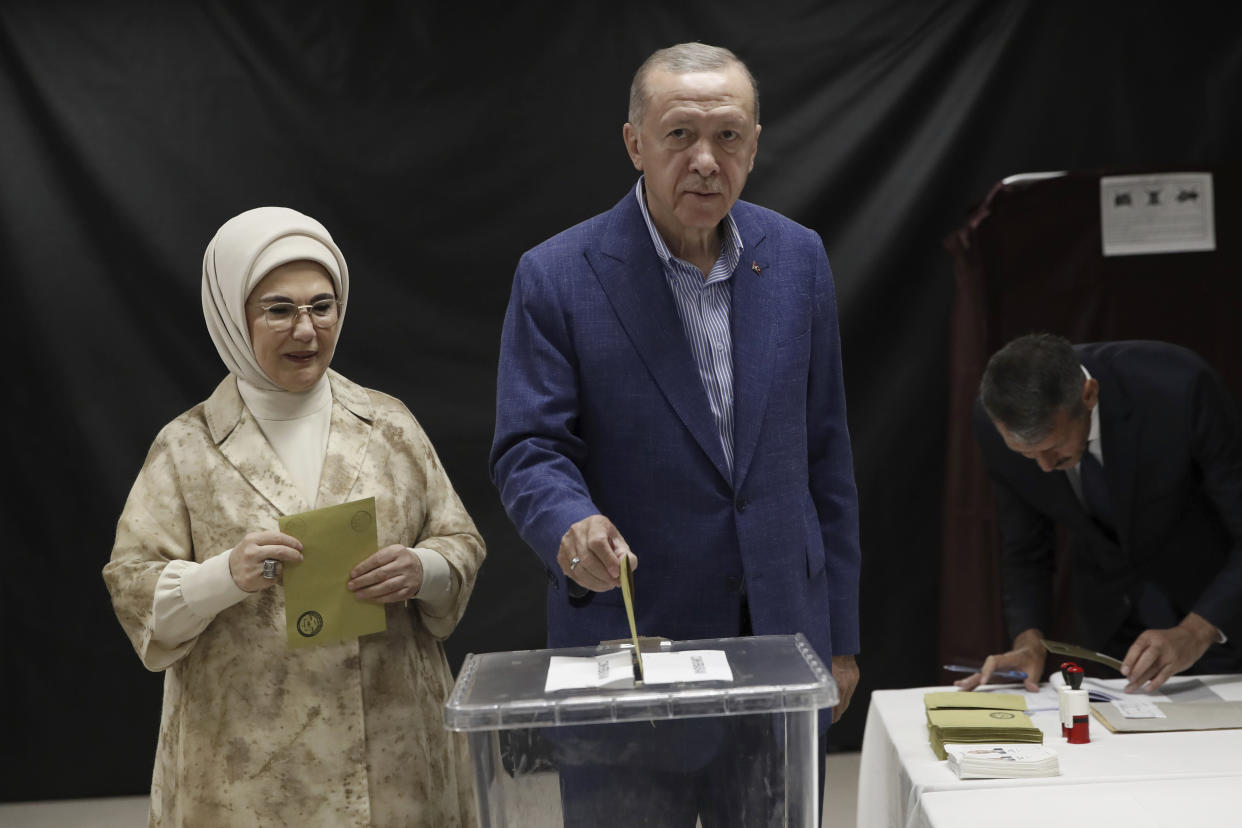 Turkish President Recep Tayyip Erdogan, right, and his wife Emine Erdogan, cast their ballots at a polling station during the second round of the presidential election in Istanbul, Sunday, May 28, 2023. Voters in Turkey returned to the polls Sunday to decide whether the country’s longtime leader, Erdogan, stretches his increasingly authoritarian rule into a third decade, or is unseated by a challenger who has promised to restore a more democratic society. (Murad Sezer/Pool Photo via AP)