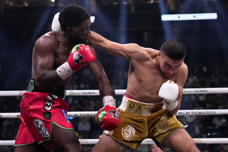 Jesus Ramos, right, fights Erickson Lubin in a super welterweight boxing match, Saturday, Sept. 30, 2023, in Las Vegas. (AP Photo/John Locher)