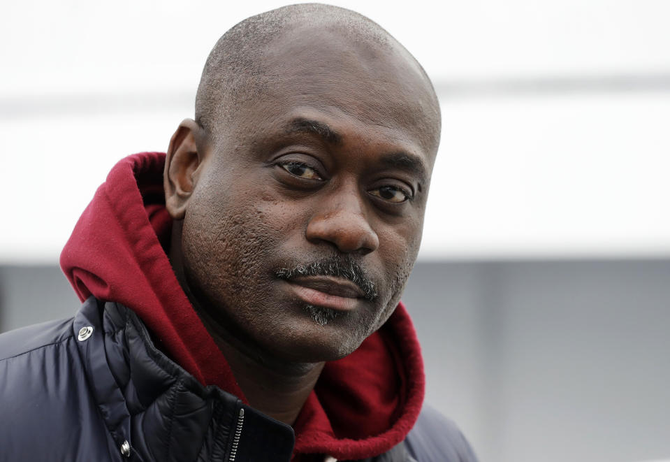 In this Nov. 30, 2018 photo, Dwayne Braithwaite poses at a Brooklyn dock in New York. Braithwaite has filed a lawsuit alleging racism and accused the city contractor that runs the docks of punishing him for not paying kickbacks. The city and its contractor, Dock NYC, say Braithwaite and his vessels violated the terms of their docking contracts at least seven times in 77 days - departing late, blasting loud music and blocking commuter ferries by tying up in the wrong spot. Braithwaite will be in a New York City court room on Wednesday, Dec. 19. (AP Photo/Mark Lennihan)