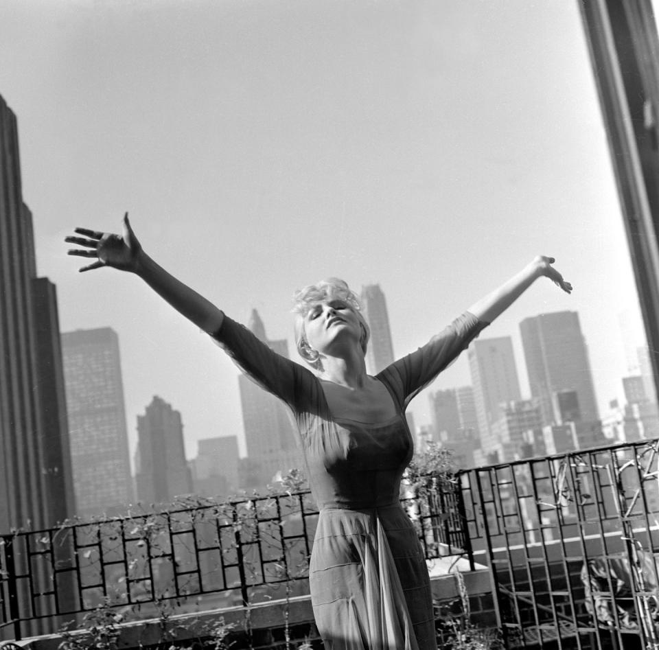 <p>Actress, singer, and dancer Julie Newmar had quite the view from the terrace of her Beekman Place apartment. This photograph was taken in 1960; later that decade, she would go on to star in <em>Batman</em> as Catwoman.</p>