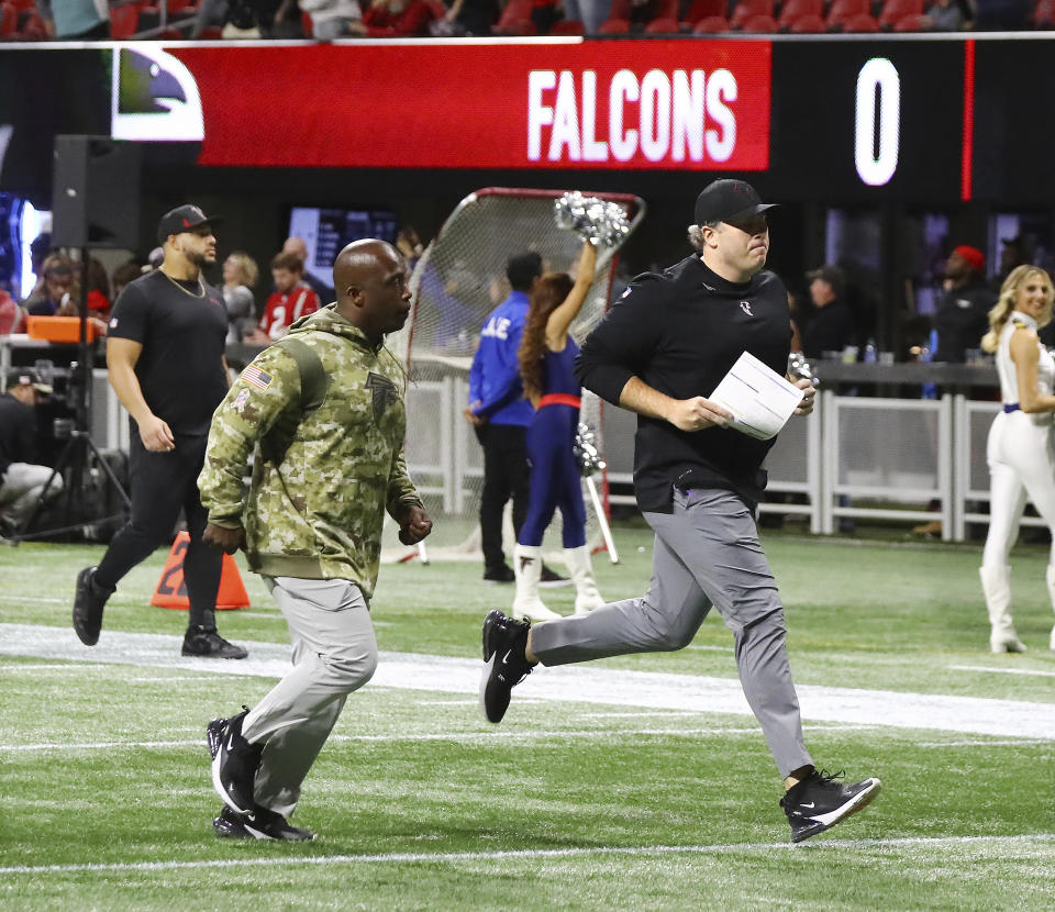 Atlanta Falcons head coach Arthur Smith runs off the field after getting shut out 25-0 to the New England Patriots in an NFL football game, Thursday, Nov. 18, 2021, in Atlanta. (Curtis Compton/Atlanta Journal-Constitution via AP)