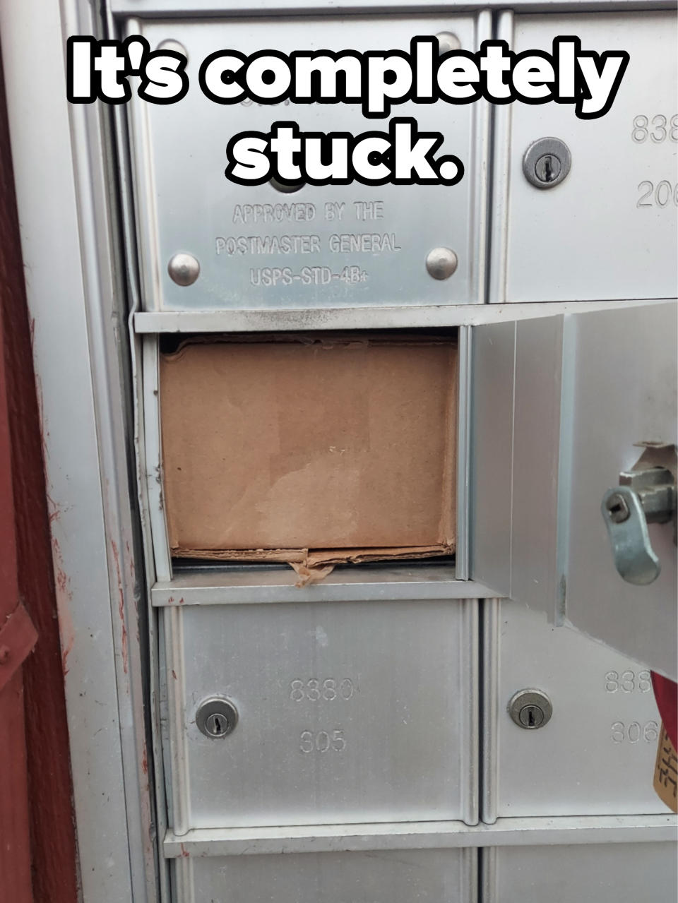 A cardboard box completely filling a mailbox