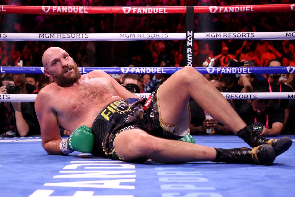 Tyson Fury reacts after a  knock down by Deontay Wilder.