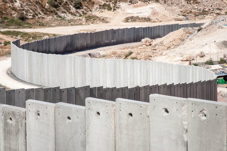 <span class="caption">Israel and Palestine, walls apart .</span> <span class="attribution"><a class="link " href="https://www.shutterstock.com/image-photo/israeli-separation-security-wall-palestine-627965915" rel="nofollow noopener" target="_blank" data-ylk="slk:Shutterstock;elm:context_link;itc:0;sec:content-canvas">Shutterstock</a></span>