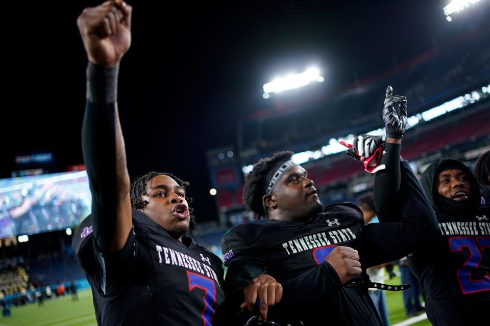 Tennessee State quarterback Draylen Ellis (7) and defensive lineman Terrell Allen (9) celebrate after defeating Norfolk State in the TSU homecoming game at Nissan Stadium in Nashville, Tenn., Saturday, Oct. 14, 2023.