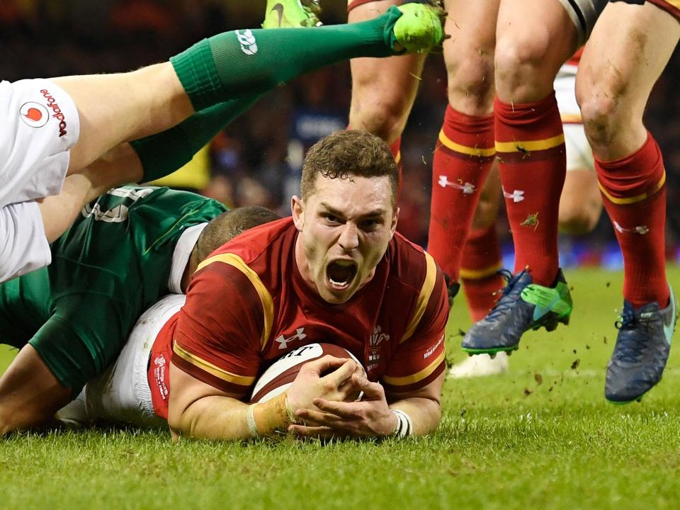 George North celebrates scoring the opening try for Wales: Getty