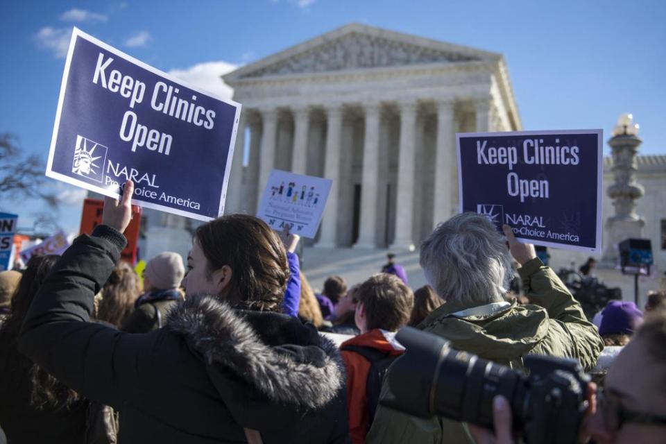 Pro-choice: Activists rally as the Supreme court hears the controversial 2016 Texas abortion access case (EPA)