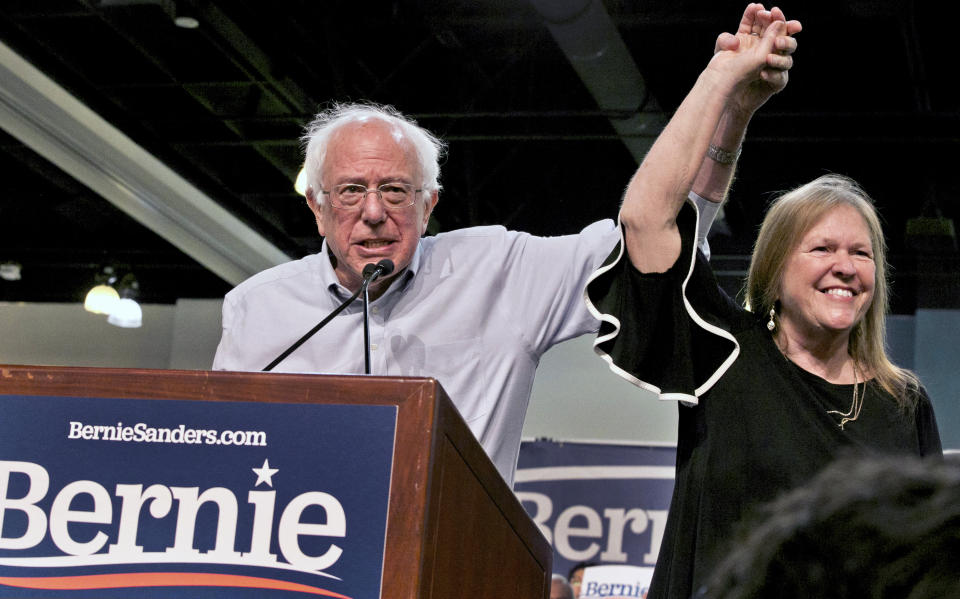 Democratic presidential candidate Sen. Bernie Sanders, I-Vt., with his wife, Jane O’Meara Sanders, salute the crowd as they arrive at a campaign event in Pasadena, Calif., in May. (Photo: Damian Dovarganes/AP)