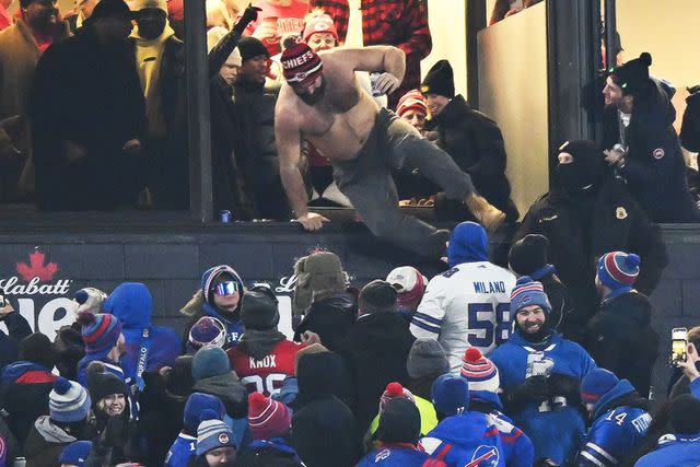 <p>Kathryn Riley/Getty Images</p> Jason Kelce #62 of the Philadelphia Eagles celebrates and jumps from his box after the Kansas City Chiefs score a touchdown