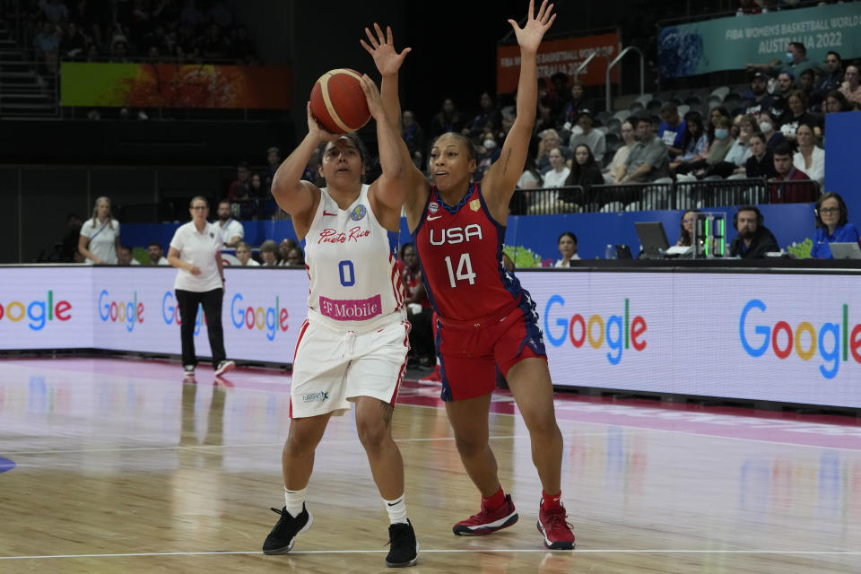 Puerto Rico's Jennifer O'Neill tries to shoot near United States' Betnijah Laney at the women's Basketball World Cup in Sydney, Australia, Friday, Sept. 23, 2022. (AP Photo/Mark Baker)