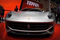 A new Ferrari F12 Berlinetta makes its world premiere at the Italian carmaker's booth at the Geneva Motor Show. Sports cars, reputed for being energy guzzlers, are now trying to boost their green credentials as they seek to attract environmentally conscious consumers and meet new climate standards