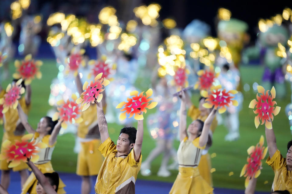 Performers take part in the closing ceremony of the 19th Asian Games in Hangzhou, China, Sunday, Oct. 8, 2023. (AP Photo/Eugene Hoshiko)