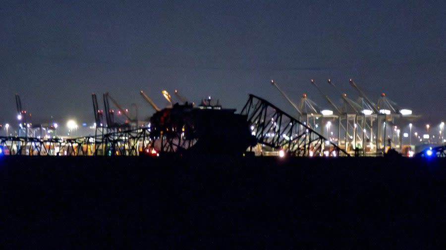 Parts of the Francis Scott Key Bridge remain after a container ship collided with a support Tuesday, March 26, 2024 in Baltimore. The major bridge in Baltimore snapped and collapsed after a container ship rammed into it early Tuesday, and several vehicles fell into the river below. Rescuers were searching for multiple people in the water. (Kaitlin Newman/The Baltimore Banner via AP)