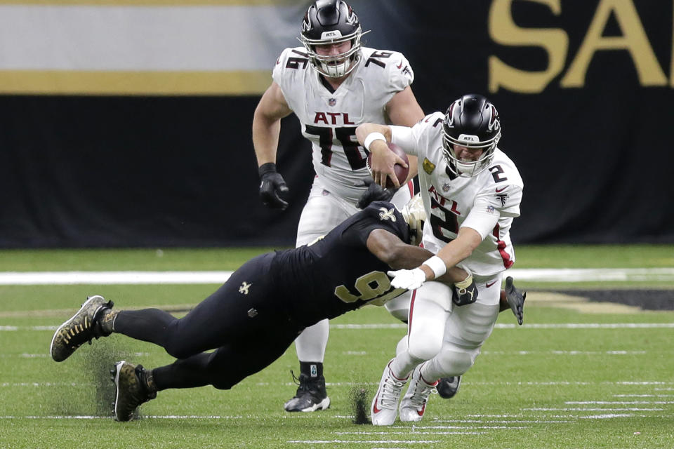 Atlanta Falcons quarterback Matt Ryan (2) is sacked by New Orleans Saints defensive end Cameron Jordan in the second half of an NFL football game in New Orleans, Sunday, Nov. 22, 2020. (AP Photo/Brett Duke)