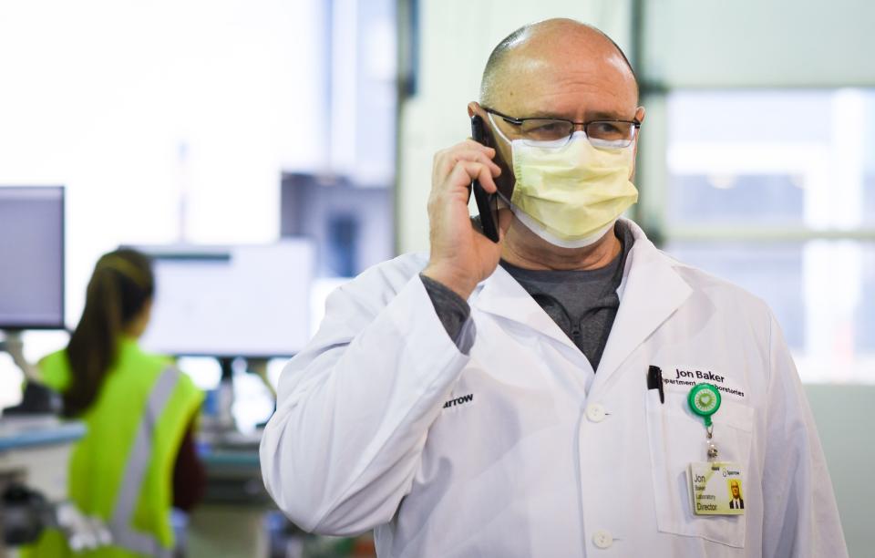 Jon Baker, Sparrow Health System's Director of Laboratories pictured at the Sparrow Drive Thru-Services center at the Frandor Shopping Center, Wednesday, Jan. 12, 2022.  The lab has processed over 250,000 COVID-19 tests since the drive-thru center opened.