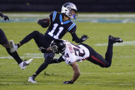 Carolina Panthers wide receiver Robby Anderson is tackled by Atlanta Falcons cornerback A.J. Terrell during the second of an NFL football game Thursday, Oct. 29, 2020, in Charlotte, N.C. (AP Photo/Gerry Broome)