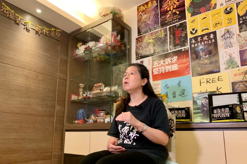 Office worker Daisy Lam speaks to Reuters at her living room in Hong Kong