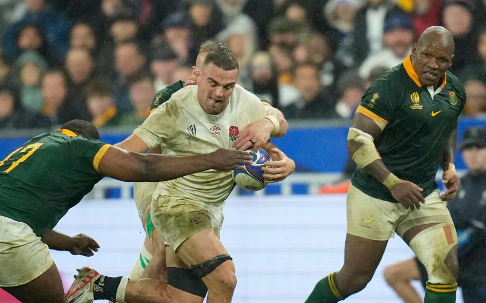 England's Ben Earl, centre, its tackled by South Africa's Ox Nche during the Rugby World Cup semifinal match between England and South Africa at the Stade de France