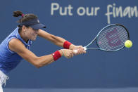 Ajla Tomljanovic, of Australia, returns a shot to Petra Kvitova, of the Czech Republic, during a quarterfinal match at the Western & Southern Open tennis tournament Friday, Aug. 19, 2022, in Mason, Ohio. (AP Photo/Jeff Dean)