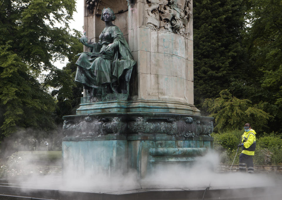 Council workers clean graffiti, that included the letters "BLM" and the words "murderer" and "slave owner", from a statue of Queen Victoria in Woodhouse Moor, Leeds, following a raft of Black Lives Matter protests that took place across the UK over the weekend. The protests were sparked by the death of George Floyd, who was killed on May 25 while in police custody in the US city of Minneapolis.