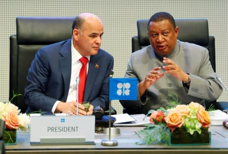 Venezuela's Oil Minister Manuel Quevedo listens to OPEC Secretary General Mohammad Barkindo at the beginning of an OPEC meeting in Vienna