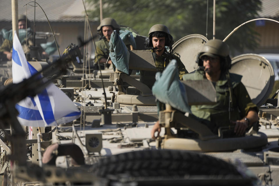 Israeli soldiers gather in a staging area near the border with Gaza Strip, in southern Israel Tuesday, Oct. 17, 2023. (AP Photo/Ariel Schalit)