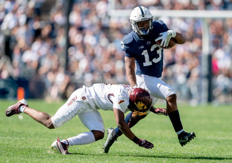 Central Michigan’s Donte Kent tries to stop Penn State running back Kaytron Allen during the game on Saturday, Sept. 24, 2022.