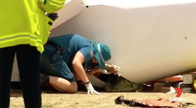 Paramedics were able to hold the woman's hand throughout the rescue. Source: 7 News