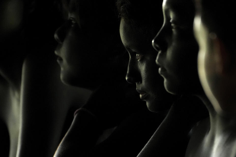 Girls take part in the afternoon ritual of the second day of the Wyra'whaw coming-of-age festival in the Ramada ritual center, in Tenetehar Wa Tembe village, located in the Alto Rio Guama Indigenous territory in Para state, Brazil, Saturday, June 10, 2023. Known as the Menina Moca in Portuguese, the three-day festival is for adolescent boys and girls in Brazil's Amazon. (AP Photo/Eraldo Peres)