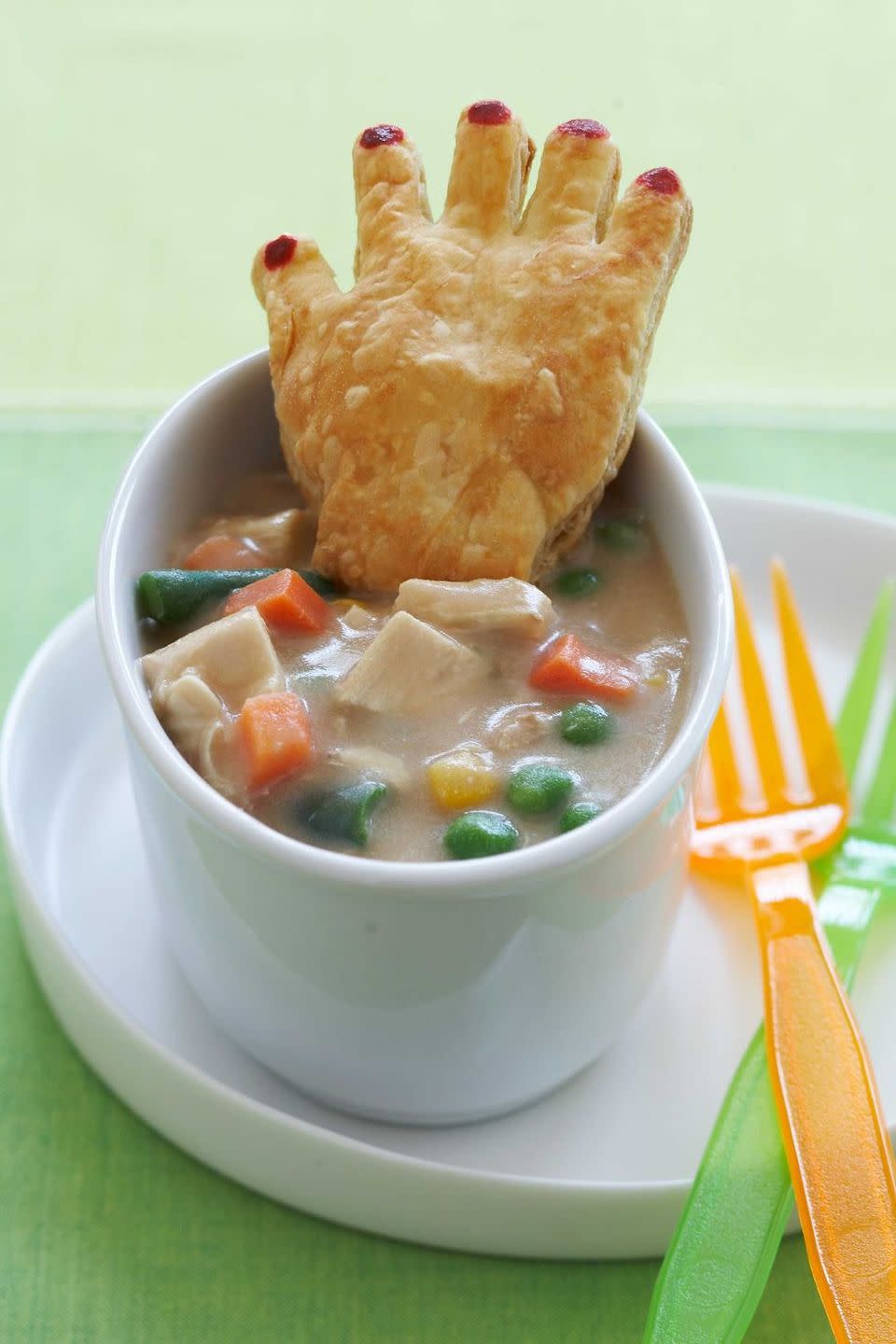 <p>This savory pot pie is packed with veggies and protein to keep your little ghost or goblin well nourished for the night ahead.</p><p>Get the recipe from <a href="https://www.womansday.com/food-recipes/food-drinks/recipes/a11095/chicken-potpie-crawling-hands-recipe-122451/" rel="nofollow noopener" target="_blank" data-ylk="slk:Woman's Day;elm:context_link;itc:0;sec:content-canvas" class="link ">Woman's Day</a>.</p>