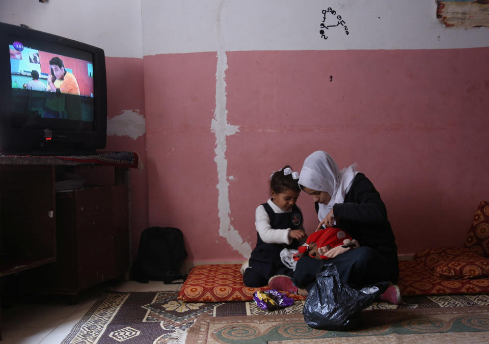 Palestinian high school student Wessal Abu Amra, 17, plays with her sister in their family house, in Gaza City, Feb. 14, 2019. (Photo: Samar Abo Elouf/Reuters)    