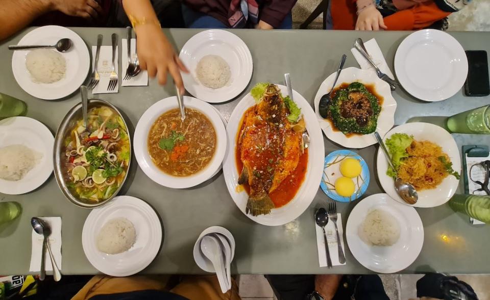 Mohd Chan - Table full of side dishes and rice